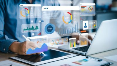 An analyst uses a computer and dashboard for data business analysis and Data Management System with KPI and metrics connected to the database for technology finance, operations, sales, marketing